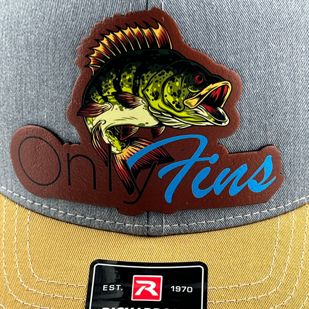 Close-up of the Only Fins bass patch on a heather grey cap