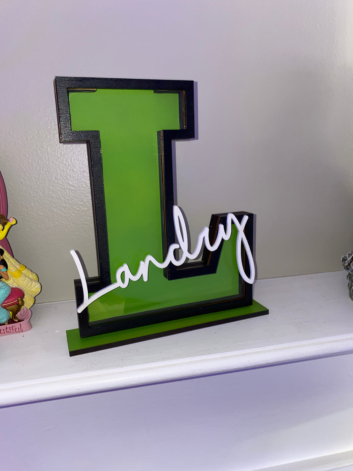 Green letter L name piggy bank with the name Landry