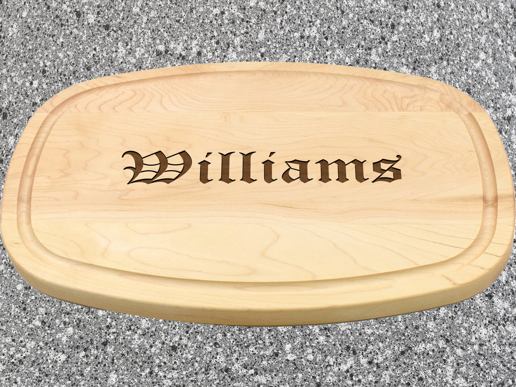 Wooden cutting board with engraved last name